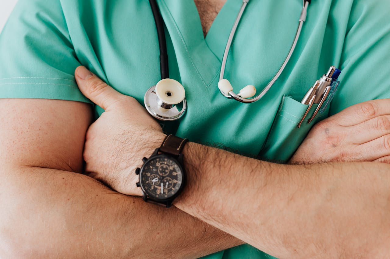 A healthcare professional in green scrubs.