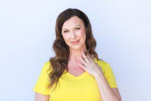 A woman in a yellow top.